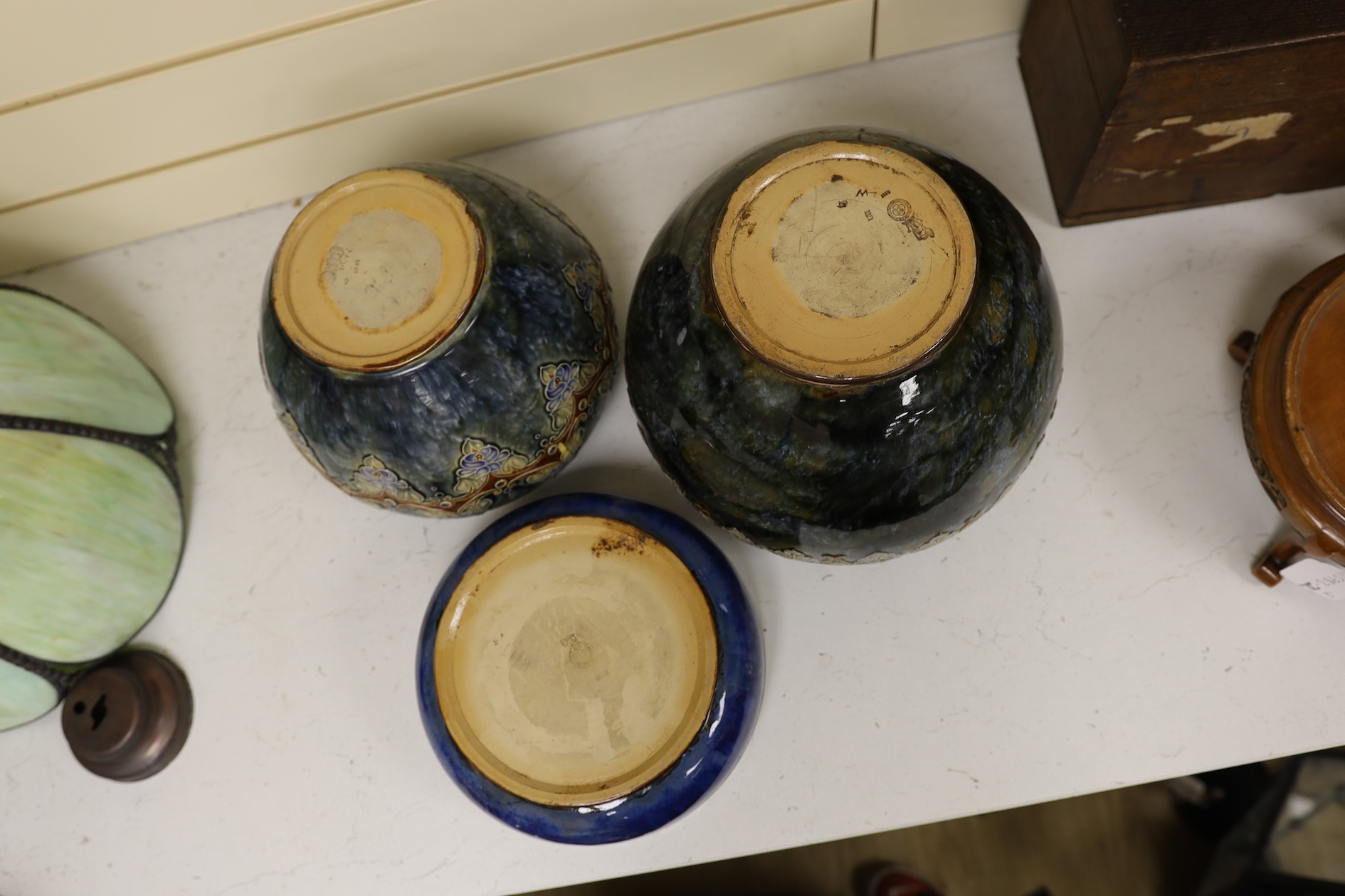 Two Royal Doulton early 20th century stoneware jardinieres and a similar stoneware bowl, tallest jardiniere 22cm high. Condition - frilled edge jardiniere chipped